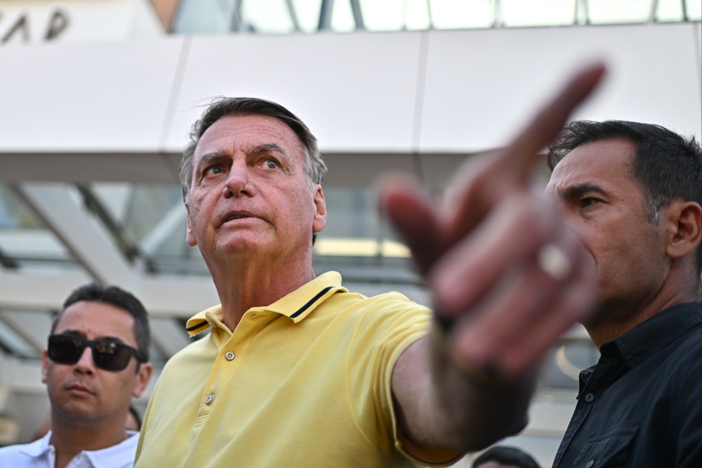 Former Brazilian president Jair Bolsonaro (centre) leaves a branch of the DF Star hospital services in Brasilia on Saturday. Photo: EPA