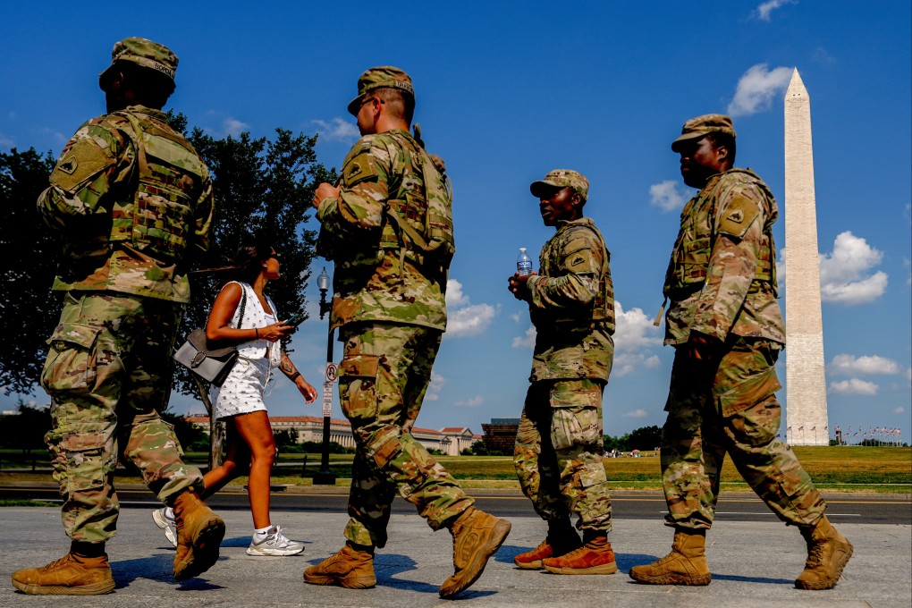 Members of the District of Columbia National Guard patrol along the National Mall in Washington on Saturday. Photo: AP