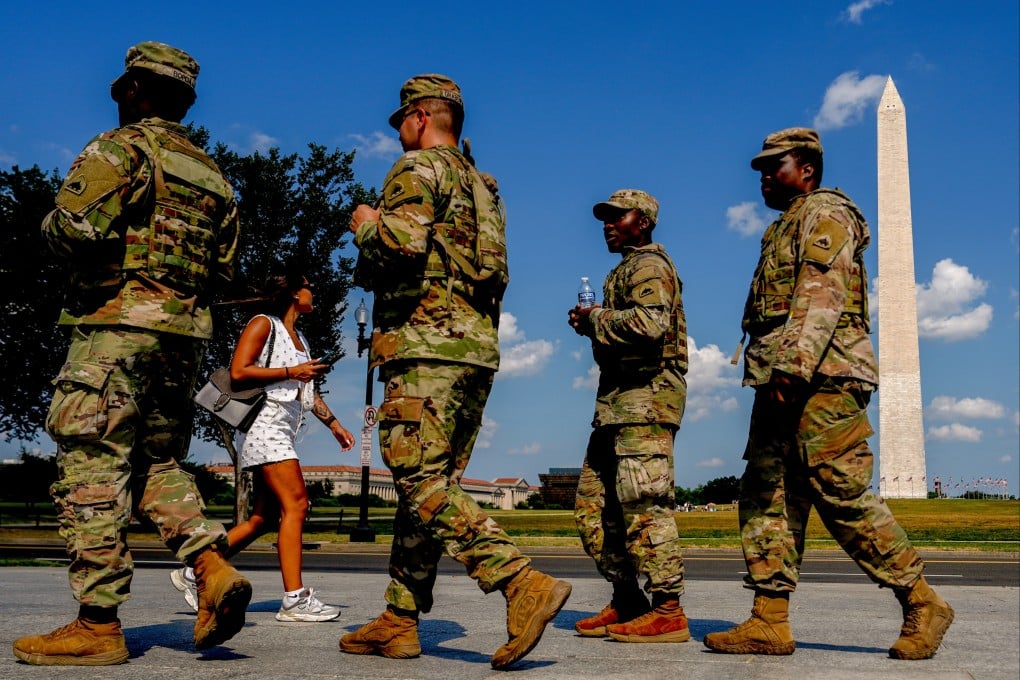 Members of the District of Columbia National Guard patrol along the National Mall in Washington on Saturday. Photo: AP