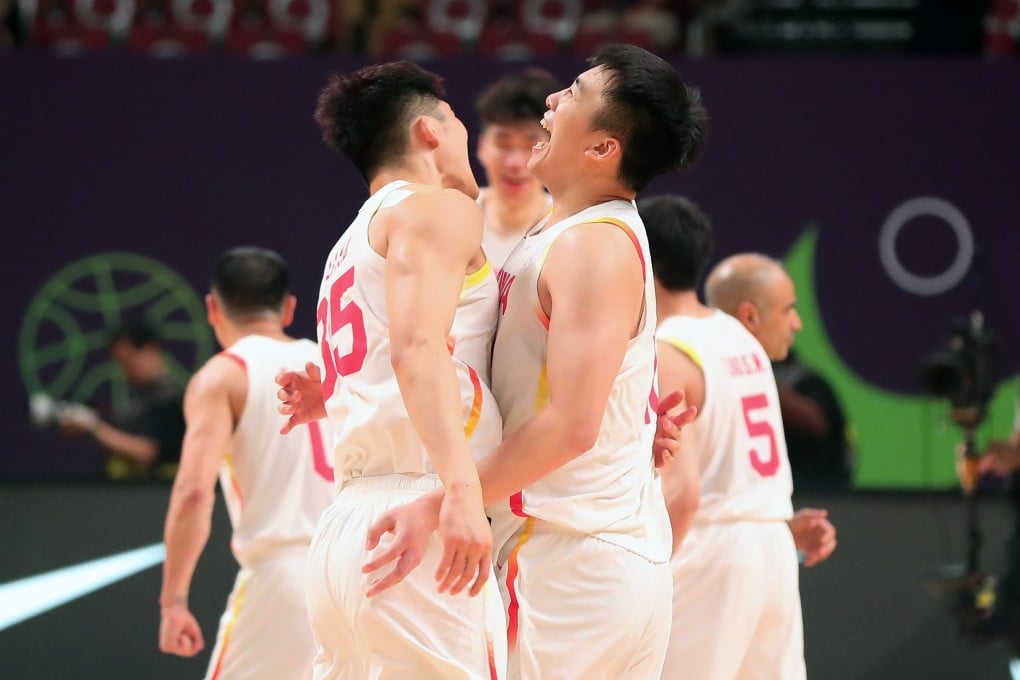 China duo Wang Junjie (right) and Li Xiangbo celebrate after their Fiba Asia Cup semi-final victory over New Zealand. Photo: Xinhua