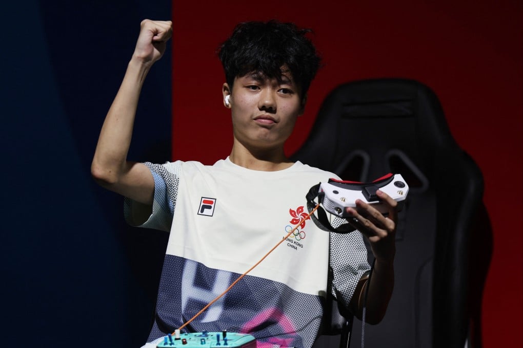 Hong Kong’s Kwan Chun-yan celebrates after finishing third in race one of the final. Photo: reuters