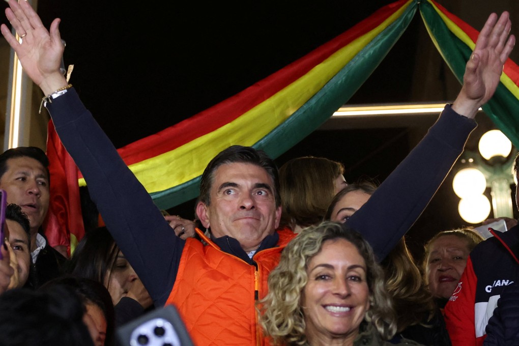 Bolivian presidential candidate Rodrigo Paz of the Christian Democratic Party, accompanied by wife Maria Elena Urquidi, reacts as early official results show that he is leading Sunday’s presidential race. Photo: Reuters