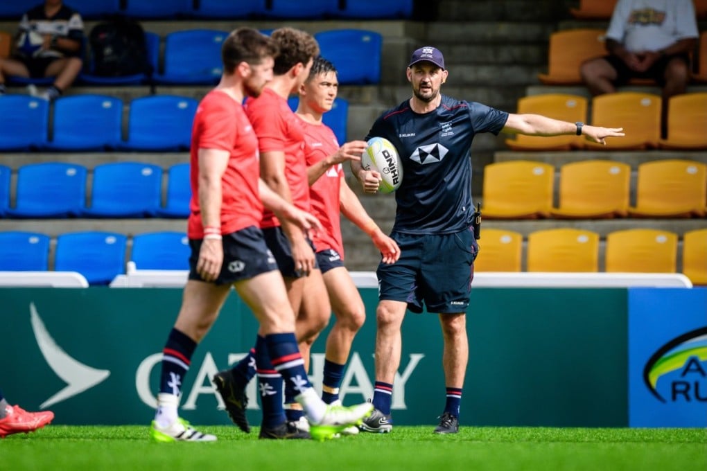 Incoming head coach Logan Asplin (right) putting the Hong Kong team through a warm-up session ahead of an Asia Rugby Championship match. Photo: HKCR