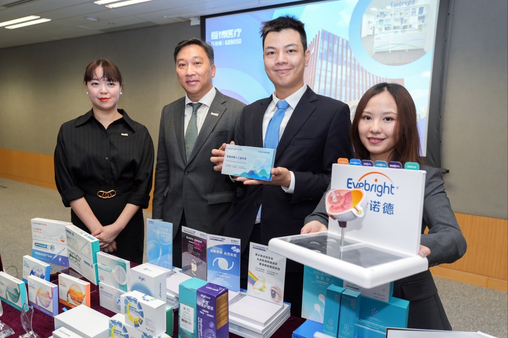 Andy Wong, head of innovation and technology at InvestHK (second left), alongside Charles Chui, public relations manager of Eyebright Medical Technology (Hong Kong) Limited, at the Central Government Offices. Photo: SCMP
