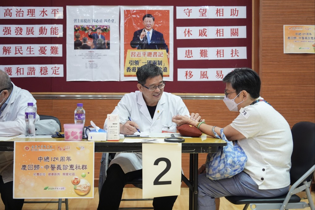 A patient receives a traditional Chinese medical consultation during a free check-up in Mong Kok sponsored by Chinese General Chamber of Commerce, on June 1. Photo: Eugene Lee