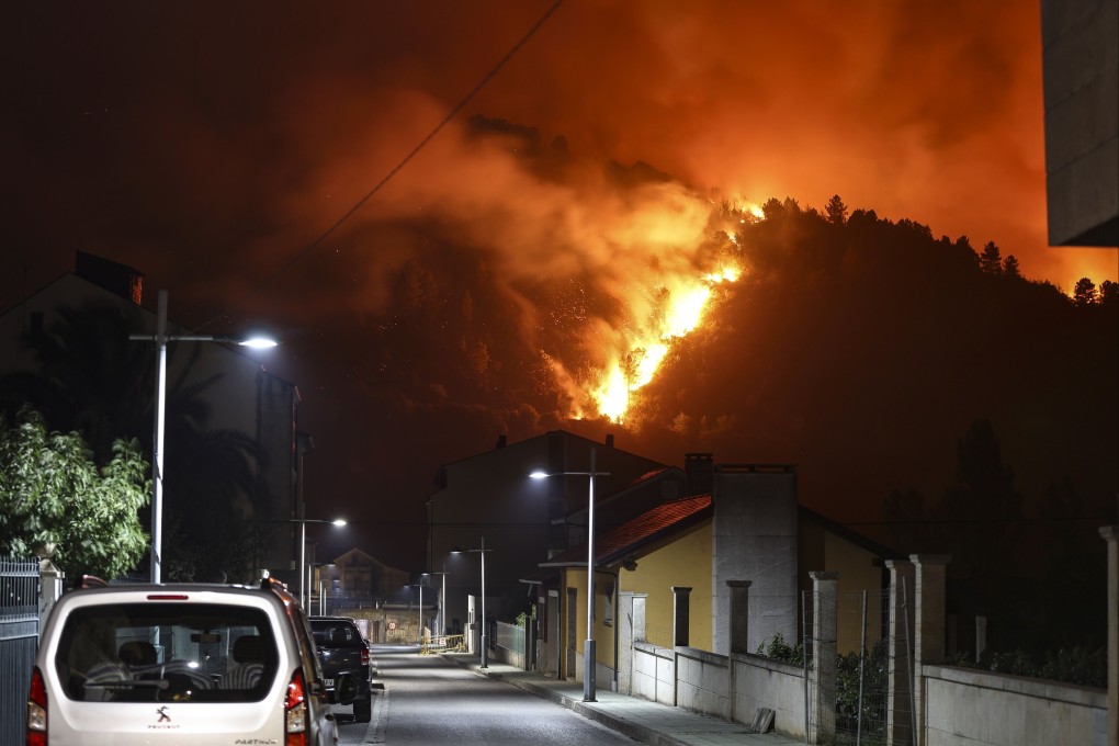 A forest fire burns in Vilamartin de Valdeorras, Galicia, Spain, on Monday. Multiple blazes continue to affect several provinces in Spain, after burning thousands of hectares across the country. Photo: EPA