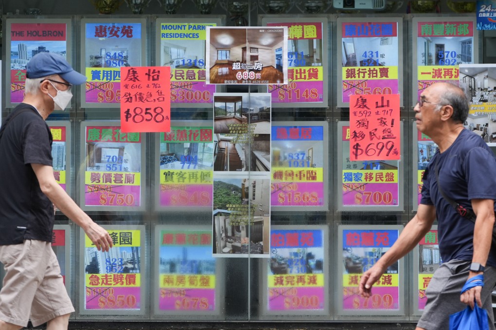 People walk past a property agency in Tai Koo on July 29, 2024. Home prices have stabilised since the start of this year after a nearly 30 per cent decline since the 2021 peak. Photo: Eugene Lee