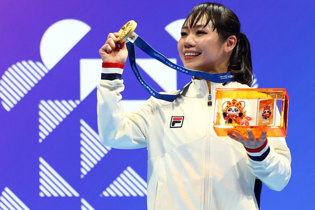 Hong Kong karate gold medallist Grace Lau Mo-sheung celebrates on the World Games podium at the Jianyang Cultural and Sports Centre Gymnasium in Chengdu on August 8. Photo: Reuters