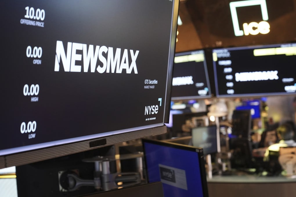 A Newsmax logo on the floor at the New York Stock Exchange in New York. Photo: AP