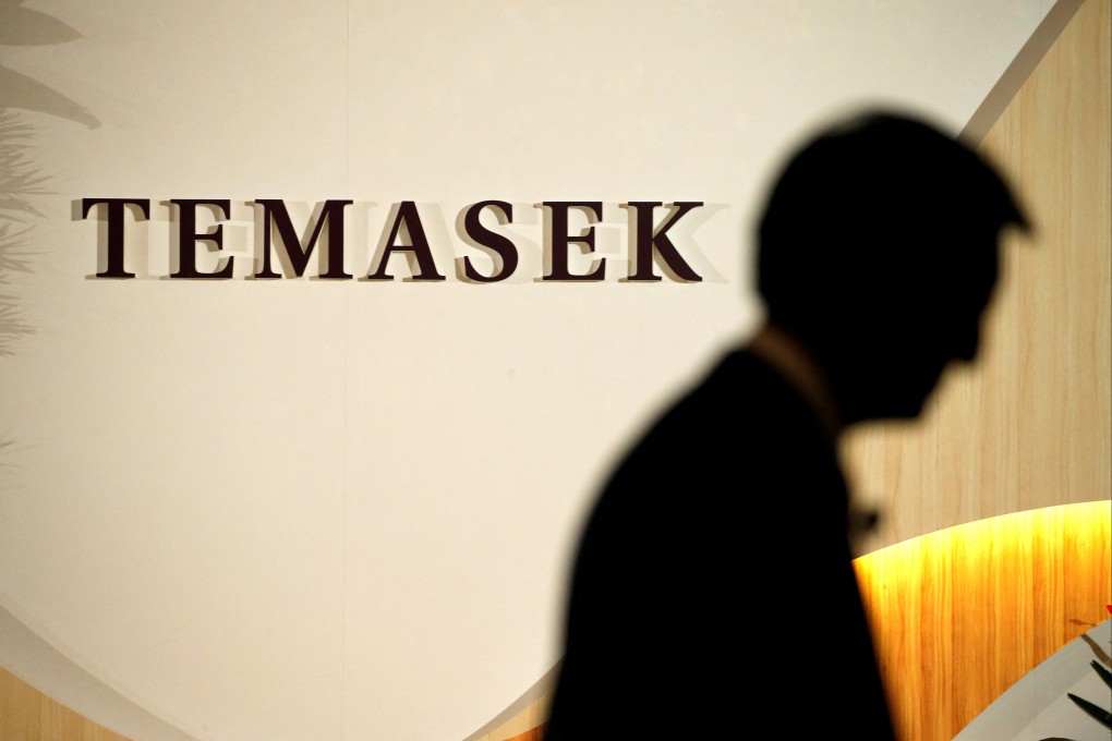 An executive prepares to take the stage during the annual Temasek Review in Singapore. The state-owned investor is weighing a reorganisation into three investment vehicles. Photo: Reuters