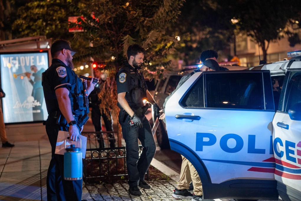 FBI, Secret Service, Homeland Security Investigations and Washington Metropolitan Police Department officers arrest a man in the Shaw neighbourhood of Washington on Monday. Photo: Getty Images via AFP