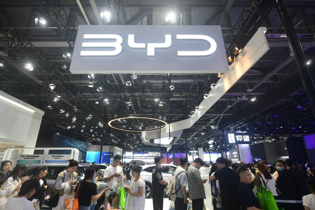 People stop by the booth of the Chinese carmaker BYD during an auto show in Hangzhou in east China’s Zhejiang province on July 1. Photo: LONG WEI / Feature China/Future Publishing via Getty Images