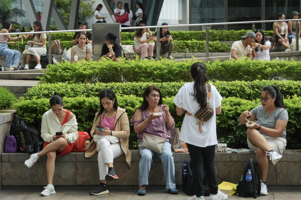 Foreign domestic helpers spend time in Central during a day off. Photo: Sun Yeung