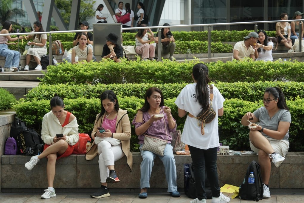 Foreign domestic helpers spend time in Central during a day off. Photo: Sun Yeung