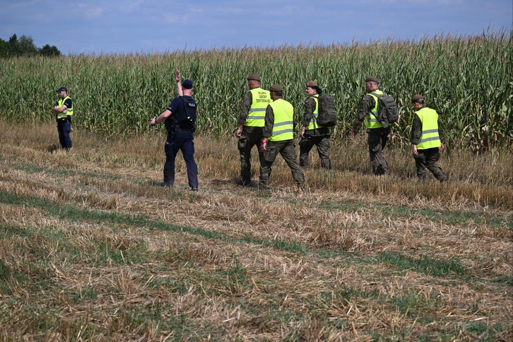 Police secure the area of a cornfield where a drone fell in Osiny, eastern Poland, on Wednesday. Photo: EPA