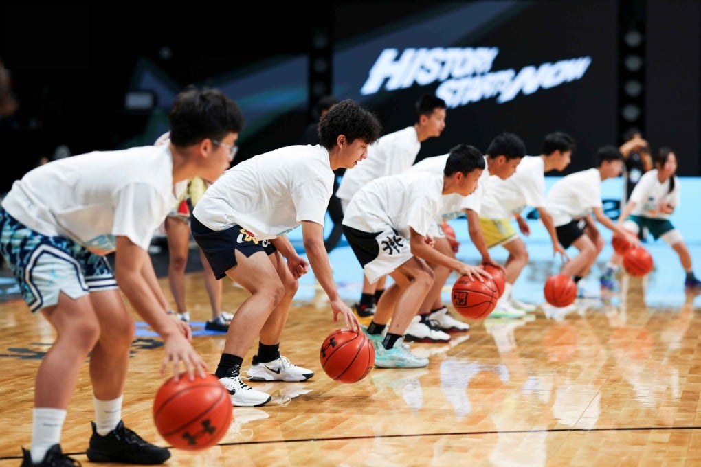 Pupils attend a training session held by the Joe Tsai Basketball Scholarship and the Asian University Basketball League in Hangzhou. Photo: AUBL
