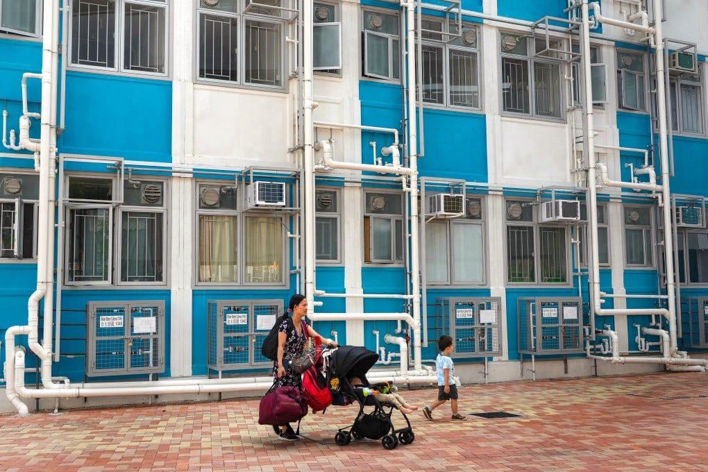 A woman and two children pass a transitional housing project in Kam Tin, Yuen Long. Photo: Elson Li