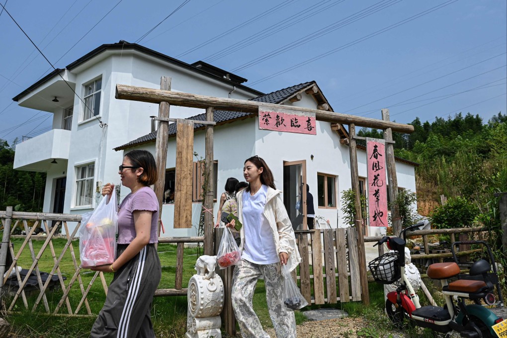 Chen Yani (centre) walks outside the women-only co-living community she set up in Hangzhou, in eastern China’s Zhejiang province. Photo: AFP