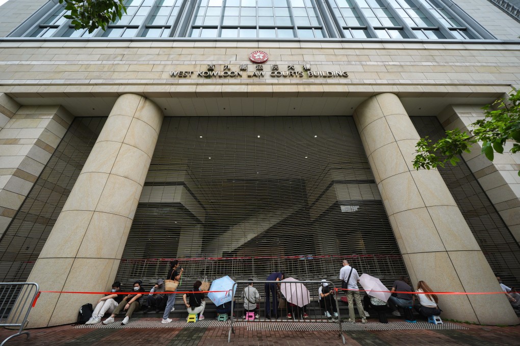 People queue up to enter West Kowloon Court for spots in the public gallery for Jimmy Lai’s trial. Photo: Eugene Lee