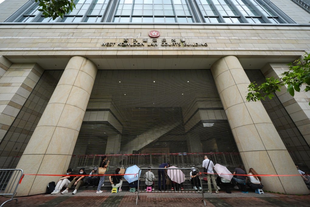 People queue up to enter West Kowloon Court for spots in the public gallery for Jimmy Lai’s trial. Photo: Eugene Lee