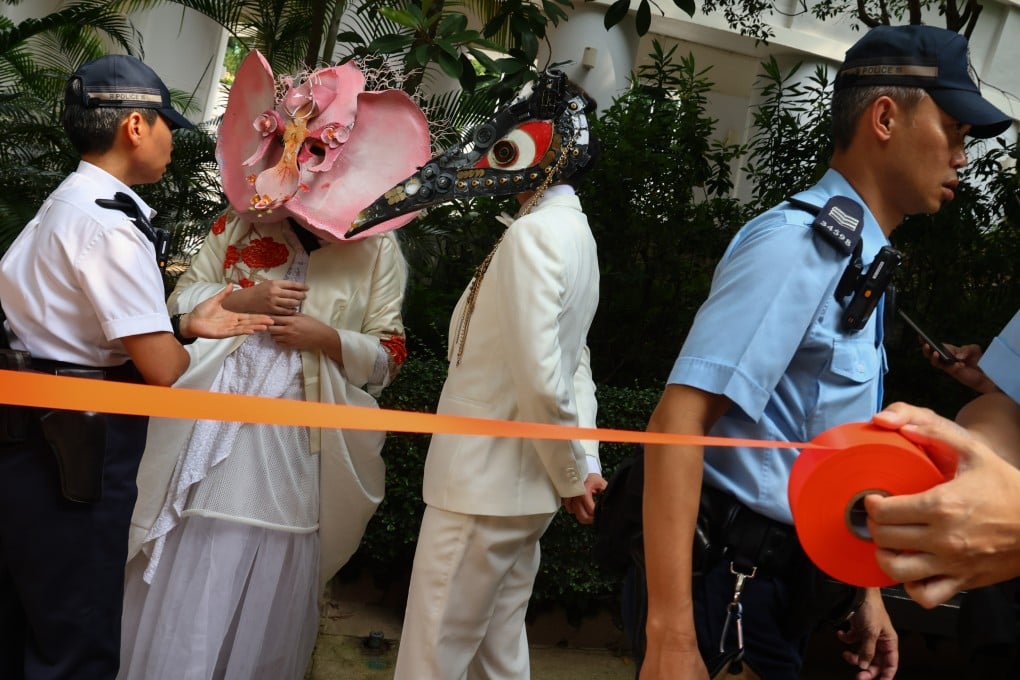 Supporters of the same-sex partnership registration bill, wearing masks of monsters to protest against the demonisation and exclusion of same-sex couples, demonstrate outside the Cotton Tree Drive Marriage Registry, in Admiralty, Hong Kong, on July 28. Photo: Dickson Lee