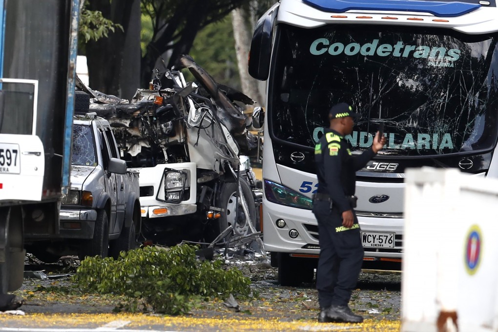 Police inspect the area after an attack near the Marco Fidel Suarez Military Aviation School in Cali, Colombia, on Thursday. Photo: EPA