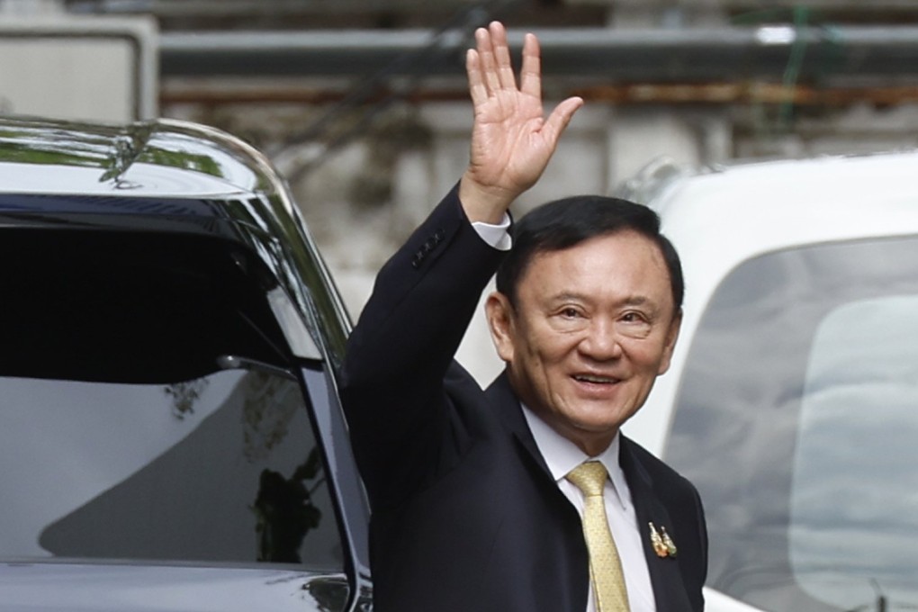 Former Thai Prime Minister Thaksin Shinawatra waves after arriving at the Criminal Court to hear the court’s decision on charges of insulting the monarchy, in Bangkok, Thailand on Friday. Photo: EPA
