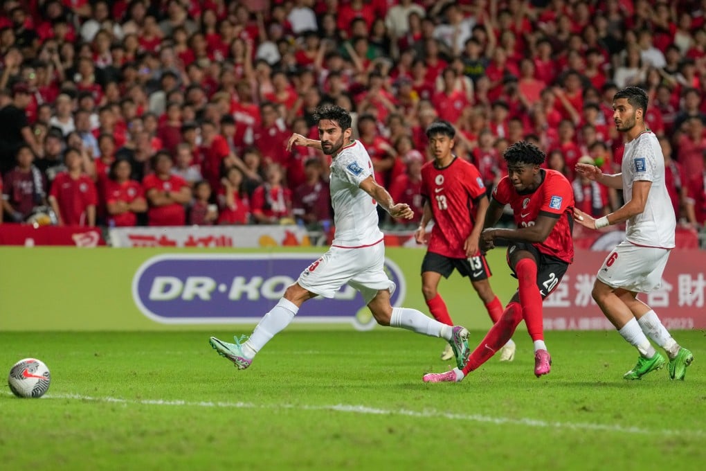 Hong Kong’s Michael Udebuluzor (second from right) shoots against Iran at Hong Kong Stadium last year. Photo: Sam Tsang