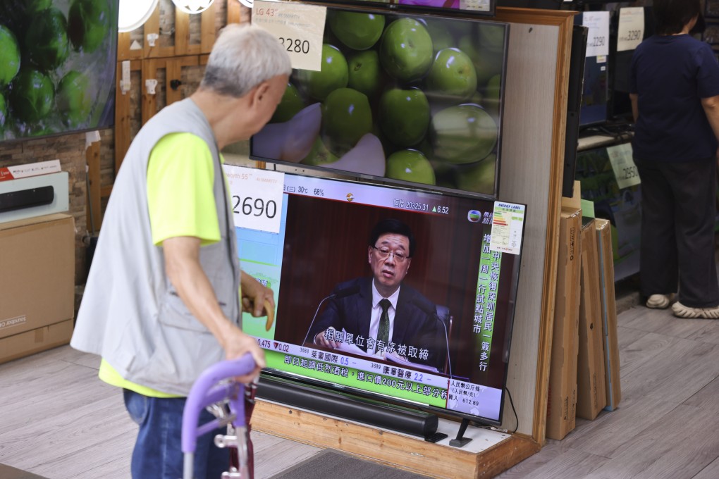 A senior in Sham Shui Po watches a live broadcast of Chief Executive John Lee Ka-chiu delivering his third policy address, on October 16, 2024. Photo: Nora Tam