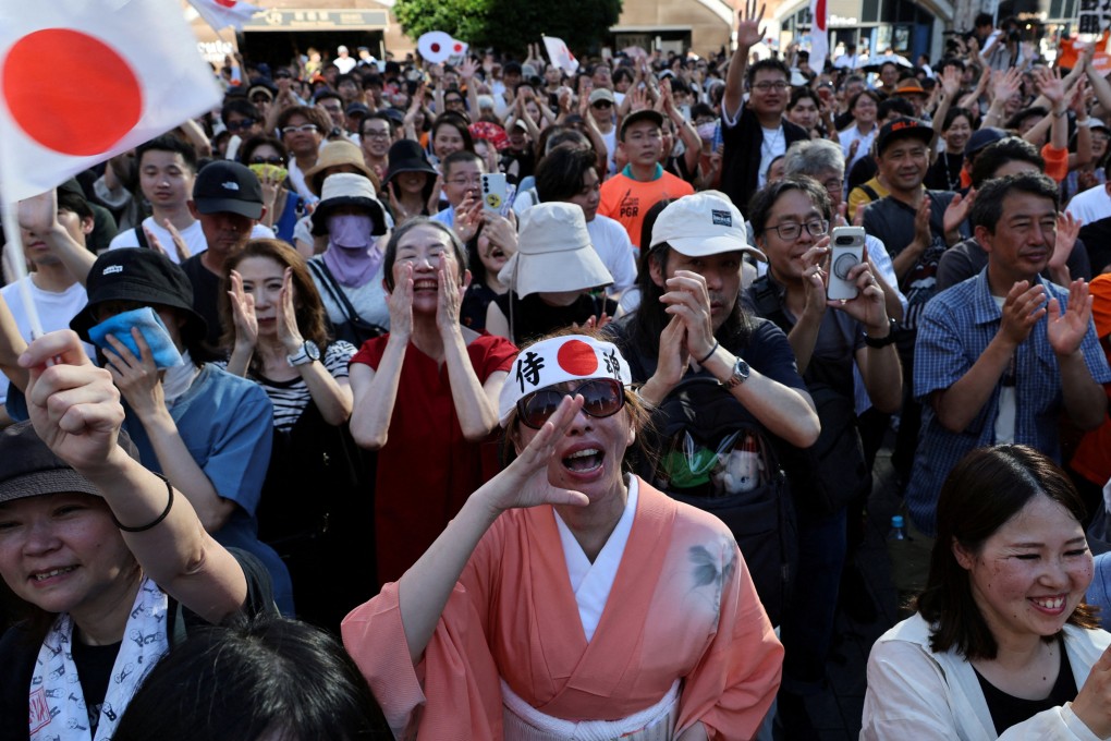 Supporters of Japan’s Sanseito, a far-right party with an anti-foreigner agenda, react during a rally in Tokyo on July 21. Photo: Reuters