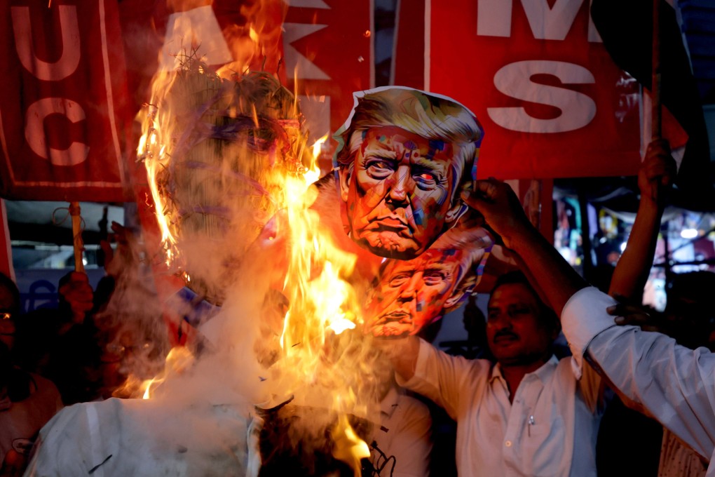 Activists of the Left party and National Congress Trade Union protest against US President Trump and his tax policies for India, and for Palestine, outside the US embassy in Kolkata, India, on August 13. Photo: EPA