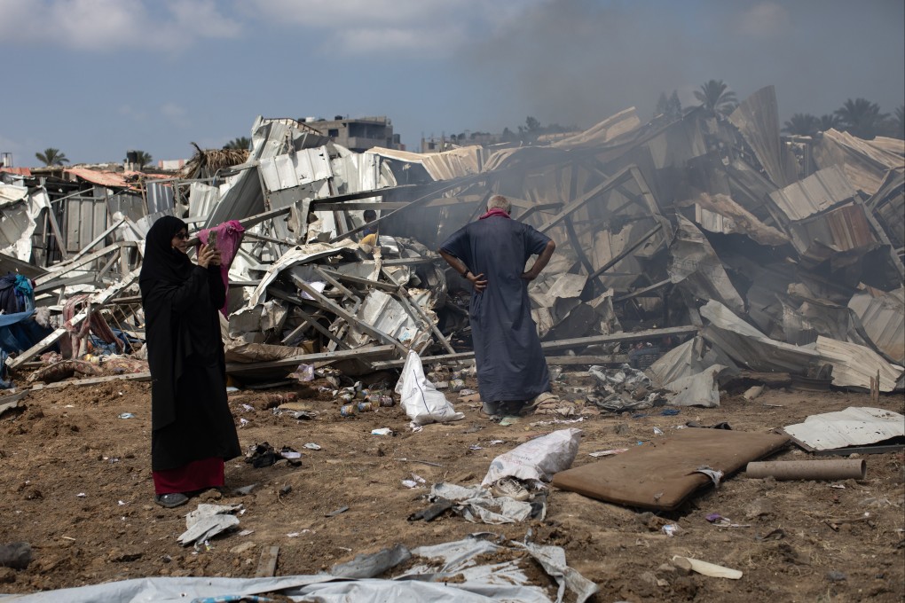 Displaced Palestinians inspect tents destroyed after an Israeli strike on the Al-Manasrah camp, which housed more than 200 families in Deir al-Balah, central Gaza Strip on Thursday. Photo: EPA