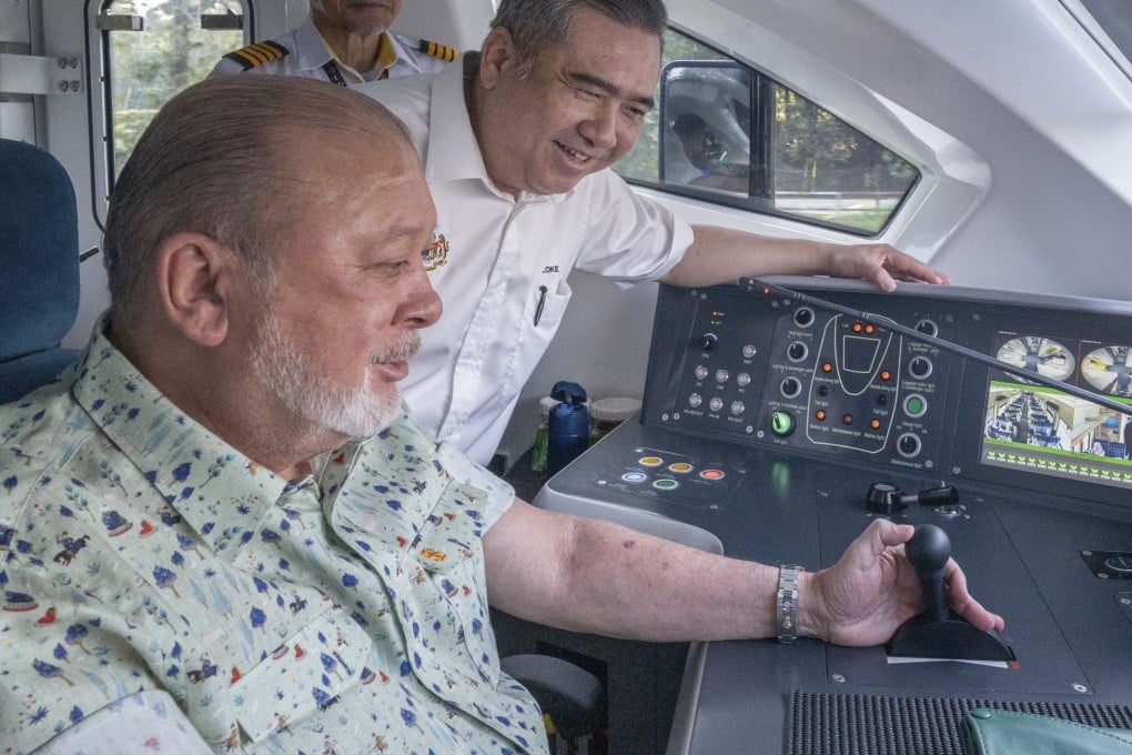 Malaysian king Sultan Ibrahim Iskandar at the controls of the electric train on Saturday. Photo: Malaysian Transport Ministry