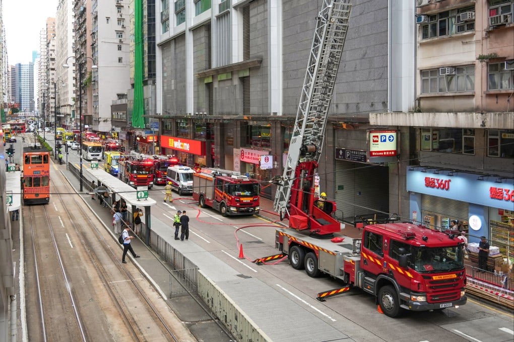 At least three fire engines and an extendable ladder were deployed. Photo: Eugene Lee