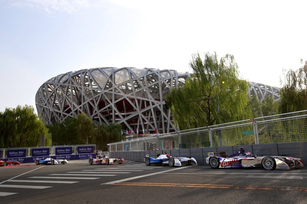 Formula E cars drive by Beijing’s National Stadium during a Formula E Championship race. Photo: Reuters