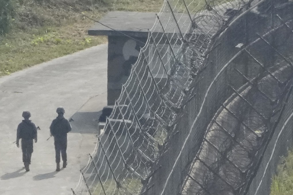 South Korean army soldiers patrol along the barbed-wire fence in Paju, South Korea, near the border with North Korea. Photo: AP