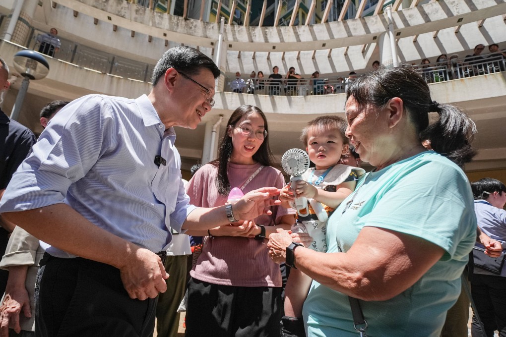 Chief Executive John Lee visits the Lower Ngau Tau Kok Estate. Photo: Eugene Lee