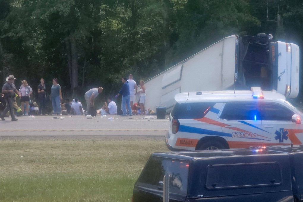 Victims and emergency personnel are seen at the site of a bus crash near Pembroke, New York, on Friday. Photo: by Mike Flaig/Facebook via AFP