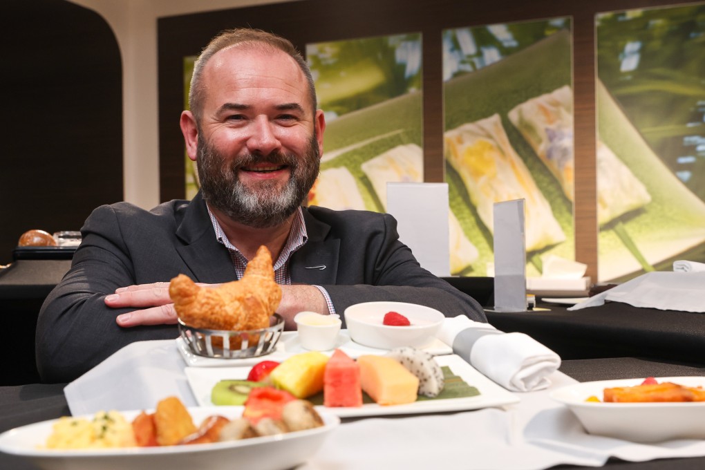 Calum Laming, chief customer officer of British Airways, shows a sample of an in-flight meal at the airline’s catering centre in Chek Lap Kok. Photo: Edmond So