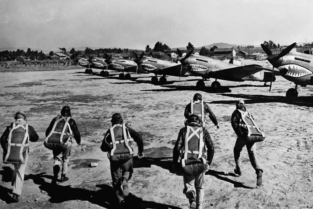 Civilian pilots of the American Volunteer Group, known as the Flying Tigers, run to their fighter planes at the sound of an air raid siren. The Flying Tigers helped to protect undermanned areas of then Nationalist-ruled China from the Japanese air force. Photo: Getty Images