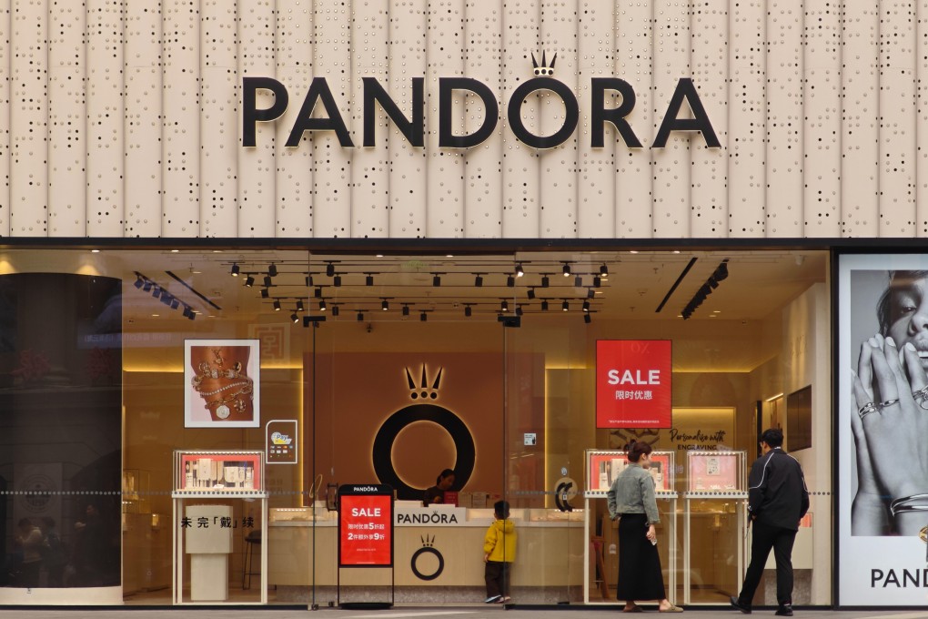 Pedestrians are seen at a Pandora store in Shanghai. Pandora’s annual sales in China peaked in 2019 and have steadily declined in recent years. Photo: Getty Images