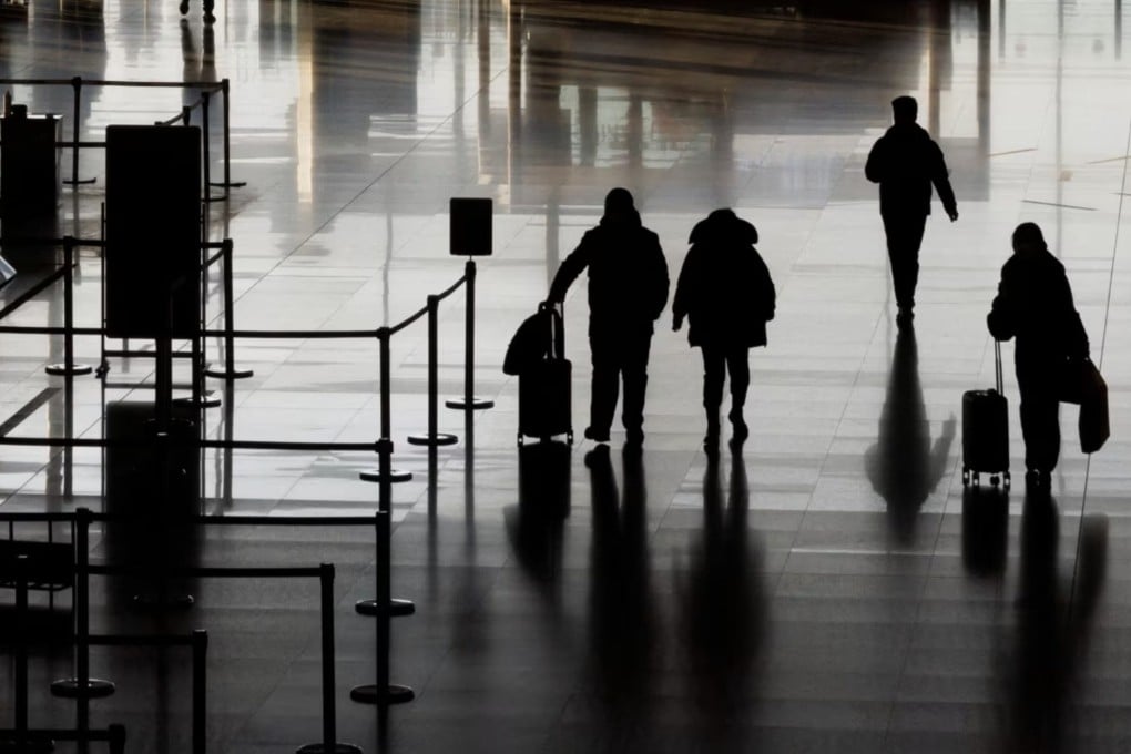 People walk in the departures hall at Beijing Capital International Airport, in Beijing, China, on January 8, 2023.