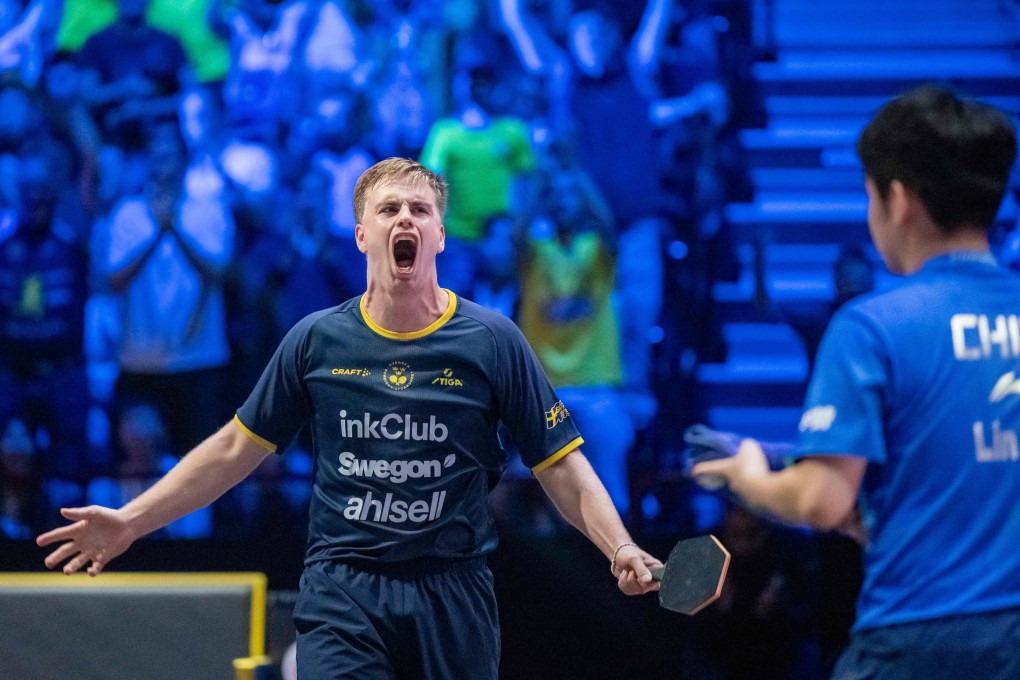 Truls Moregard celebrates victory over Lin Shidong at the Malmo Arena. Photo: AFP