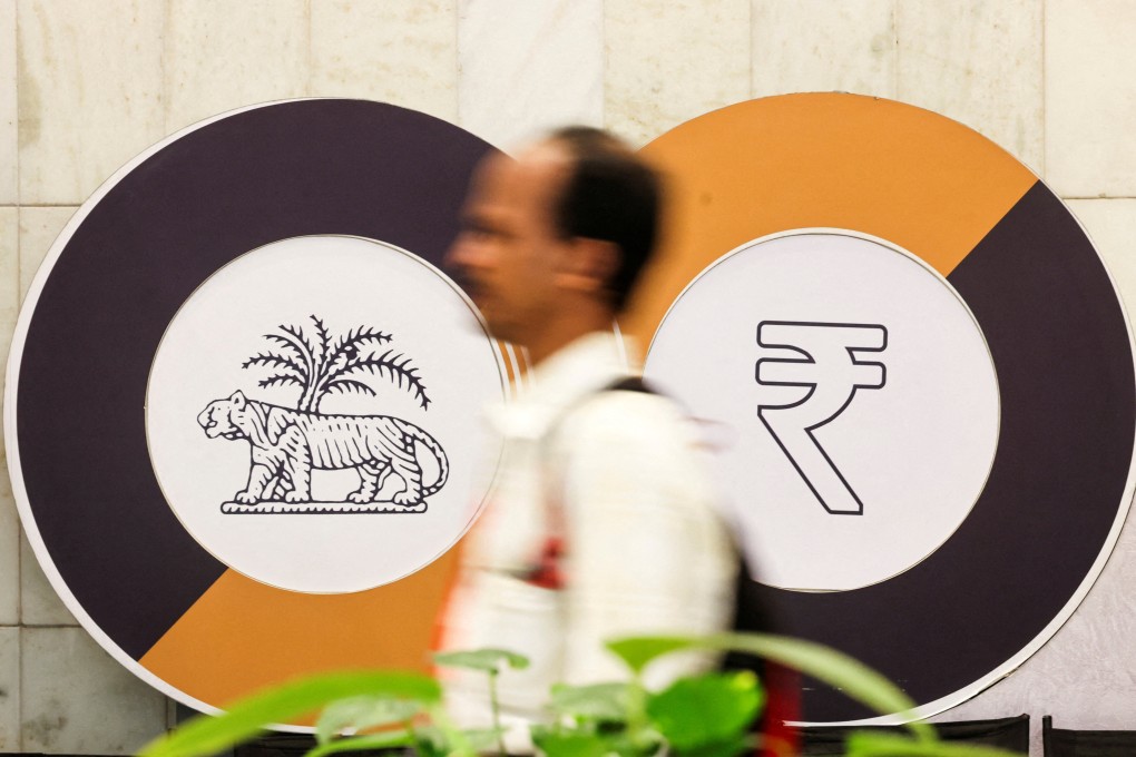 A man walks past a logo of the Reserve Bank of India inside the headquarters in Mumbai on June 12, 2024. Photo: Reuters