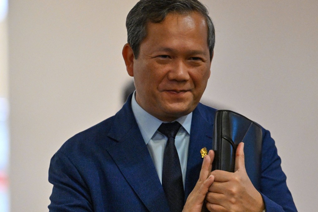 Cambodias Prime Minister Hun Manet arrives to attend a National Assembly meeting on Monday, where lawmakers passed legislation allowing for citizenship to be revoked. Photo: AFP