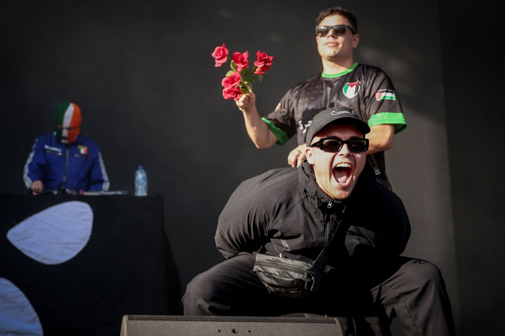 Kneecap’s Liam O’Hanna, aka Mo Chara, centre, and Naoise O Caireallain, aka Moglai Bap, right, perform at the Rock en Seine music festival in Saint-Cloud, near Paris on Sunday. Photo: AFP