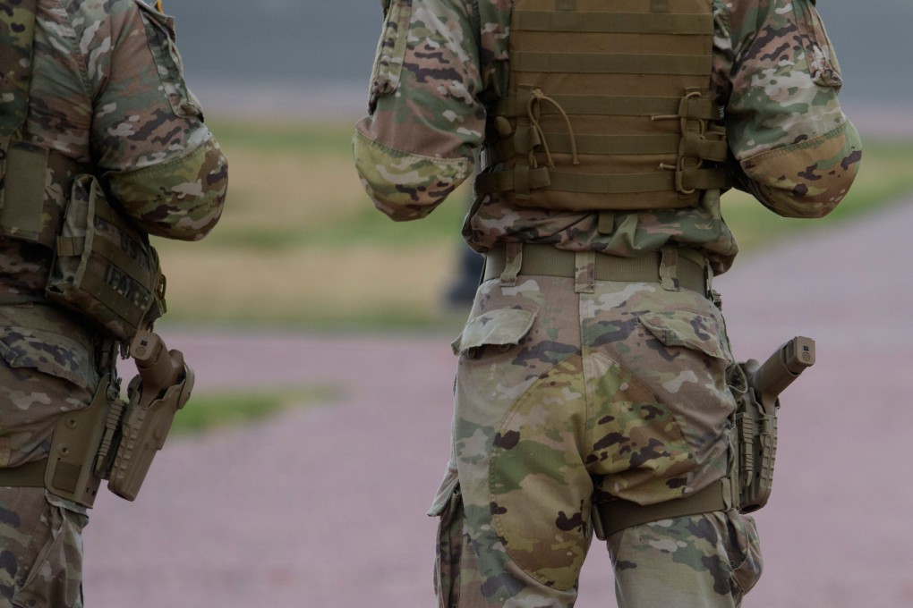 Armed members of the South Carolina National Guard stand outside Union Station in Washington on Sunday. Photo: AP
