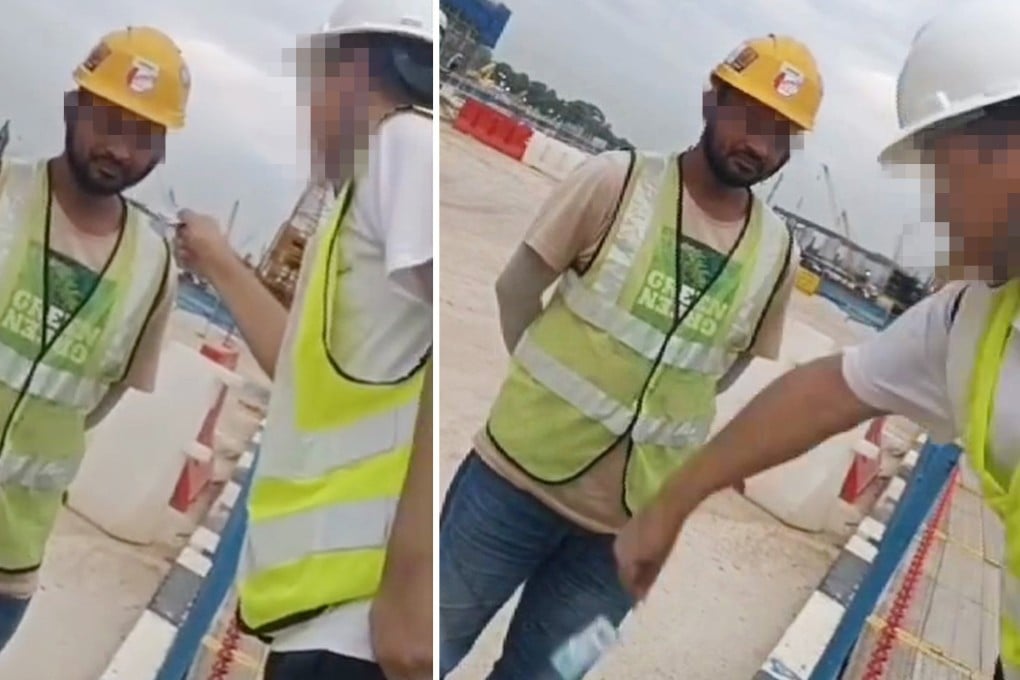 A screen capture from a video shows a Land Transport Authority (LTA) engineer scolding and swatting a migrant worker at a construction site in Singapore. Photo: Handout