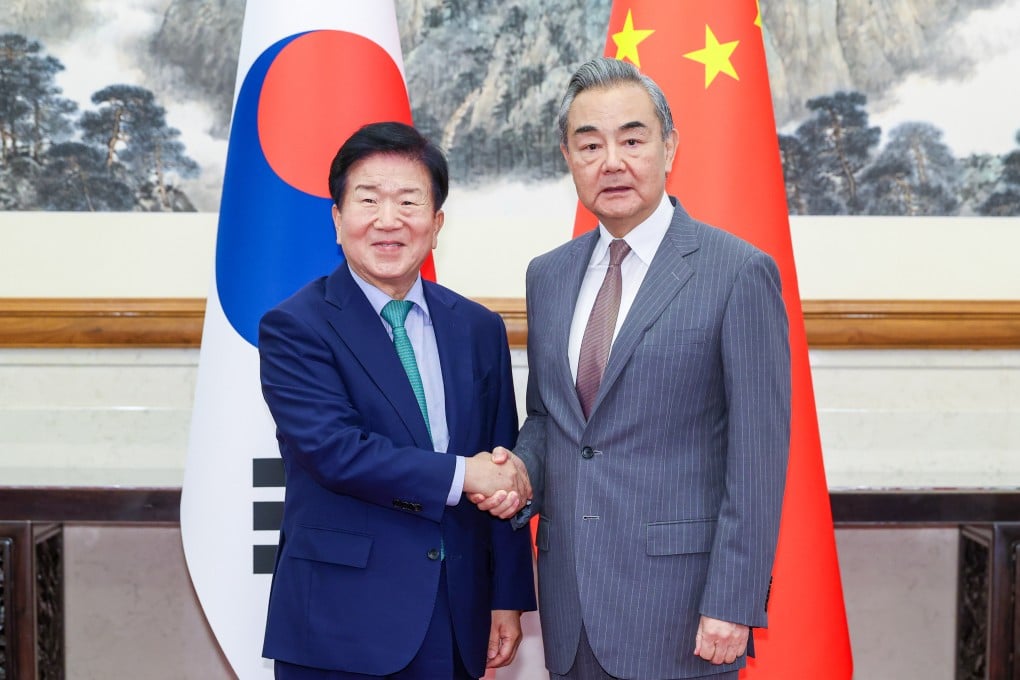 Chinese Foreign Minister Wang Yi, right, meets Park Byeong-seug, special envoy of South Korean President Lee Jae-Myung, in Beijing on Sunday. Photo: Xinhua