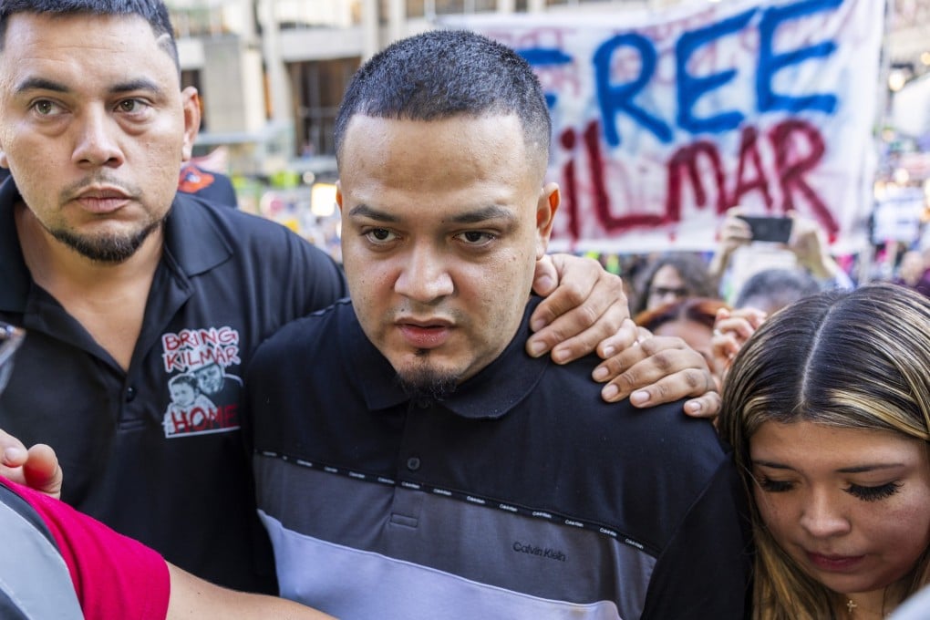 Kilmar Abrego Garcia (centre), with his wife Jennifer Vasquez Sura (right), walks to the ICE Baltimore Field Office in Baltimore on Monday. Photo: EPA